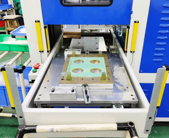 Photoelectric safety light curtain along an assembly conveyor
